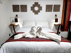 Postel nebo postele na pokoji v ubytování Hotel Sal Andina