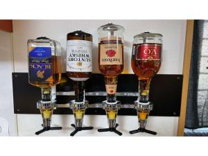four different types of beer glasses on a shelf at TAMA HOTEL - Vacation STAY 41338v in Ishinomaki