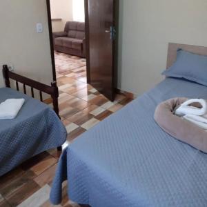 Postel nebo postele na pokoji v ubytování Pousada rancho 2d + 3 fotografie