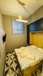 a bedroom with a large bed in a room at Madaniyat 1 in Samarkand