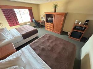 Postel nebo postele na pokoji v ubytování FairBridge Inn & Suites McAlester