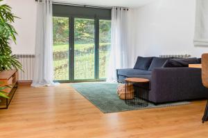 Posezení v ubytování Alojamiento junto al Río con Parking en Ransol I AndBnB