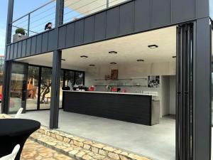 an open kitchen and dining area of a house at Mobilhome Maja in Pirovac