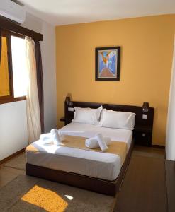 Postel nebo postele na pokoji v ubytování Hotel Chaouen