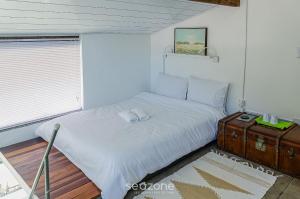 Ένα ή περισσότερα κρεβάτια σε δωμάτιο στο Aconchegante Loft na serra de Petrópolis ATO3091