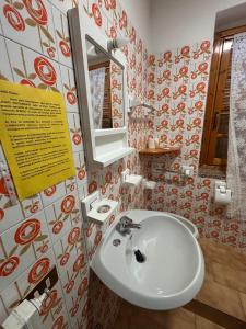 a bathroom with a sink and a mirror at B&B STELLA ALPINA in Foppolo