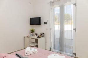 TV a/nebo společenská místnost v ubytování Vigna delle Rose