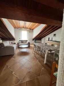 a living room with a couch and a table at Lighthouse in Licodia Eubea