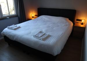 เตียงในห้องที่ NIEUW Landzicht