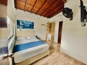 a bedroom with a bed in a room at Hotel Boutique Street 50 in Medellín