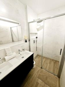 a bathroom with a sink and a shower at Stunning 2 bedrooms with private terrace in Luxembourg in Luxembourg