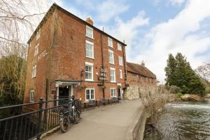 a bike parked in front of a brick building at The Old Mill Hotel in Salisbury