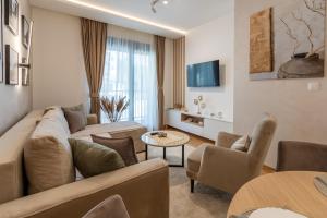 a living room with a couch and a table at Ognjen in Zlatibor