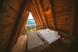 Ένα ή περισσότερα κρεβάτια σε δωμάτιο στο Poyraz bungalov 1