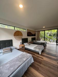 Ένα ή περισσότερα κρεβάτια σε δωμάτιο στο Hotel Rossé
