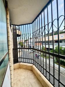 a balcony of a building with a view of a street at Apartamento com varanda 201 in Brasilia