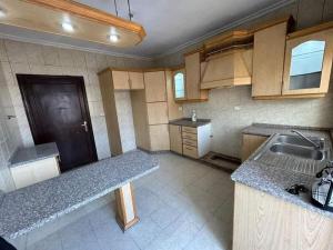 a kitchen with a sink and a counter top at ساكب هاوس in Sākib