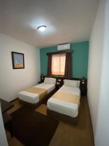 Postel nebo postele na pokoji v ubytování Hotel Chaouen