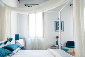 Postel nebo postele na pokoji v ubytování Aria e Luce Suites a Venezia