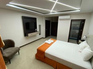 Postel nebo postele na pokoji v ubytování BRITNEY HOTEL Machala