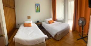 Postel nebo postele na pokoji v ubytování Hotel del Valle Azapa