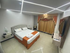 Postel nebo postele na pokoji v ubytování BRITNEY HOTEL Machala