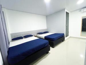 Postel nebo postele na pokoji v ubytování Bless Hotel
