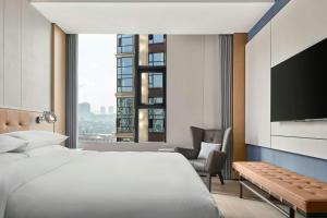 Letto o letti in una camera di Four Points by Sheraton Hengyang Zhengxiang