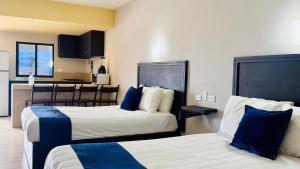 Postel nebo postele na pokoji v ubytování Hotel Jazuli
