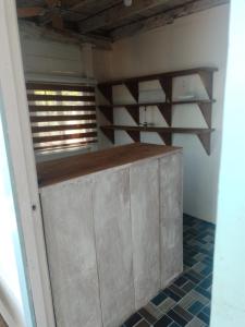 a kitchen with a counter in a room at Hostal Puerto Escondido in Bocas Town