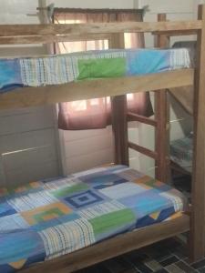 a couple of bunk beds sitting on top at Hostal Puerto Escondido in Bocas Town