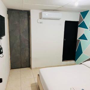 Hotel Linkon Riohacha客房内的一张或多张床位
