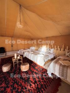Postel nebo postele na pokoji v ubytování Eco Desert Camp