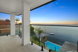 a view of the ocean from the balcony of a house at Coastal Oasis in Toukley