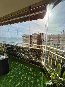 a balcony with a view of the ocean and buildings at Fuengirola, Doña Sofia amazing sea view in Fuengirola +25 photos