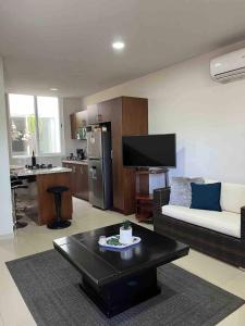 a living room with a couch and a table at Casa Soly in Mazatlán
