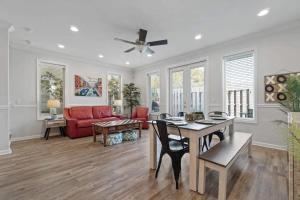 a living room with a red couch and a table at Panama City Beach Home - Few steps from the shores in Panama City Beach