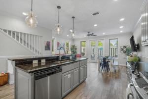 a kitchen with a sink and a counter top at Panama City Beach Home - Few steps from the shores in Panama City Beach