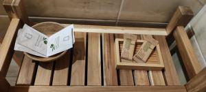 two boxes sitting on top of a wooden table at B&B il Parco stanza Garibaldi in Oriolo Romano