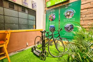 a bike parked on the grass in front of a building at La Gruta Coliving in Medellín