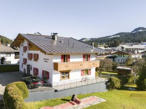 a view of a house with red shutters at Gästehaus Staffner in Sonnberg