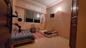 Postel nebo postele na pokoji v ubytování SK Homestay