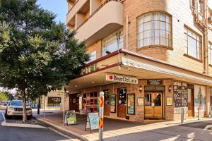 a building on the corner of a street at Beer Deluxe Albury in Albury