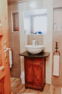 a bathroom with a sink and a mirror at Holiday house with a swimming pool Gospic, Velebit - 21753 in Gospić