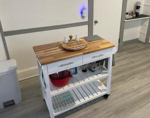a small kitchen cart with a wooden counter top at Prime Avondale in Chicago