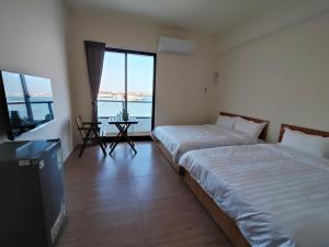 Postelja oz. postelje v sobi nastanitve Endless Summer Homestay