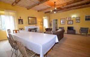 a living room with a table and a couch at 4 Bedroom Amazing Home In Cagnano in Cagnano