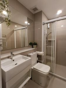 a bathroom with a sink and a toilet and a shower at Luxury condo in Bangkok,NearBTSMochit,MRTChatuchak in Bangkok