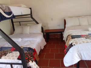 Curitagua Hotel Campestre客房内的一张或多张床位