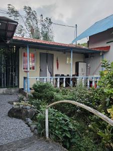 a house with a garden in front of it at Lovely Flower Garden Apartment in Alto Boquete +14 photos